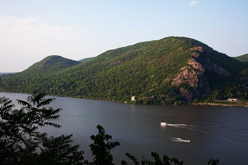 Bear Mountain appears as a slumbering, green-tree giant nestled by a cool blue lake, perfect setting for Andrea's shamanic experience.