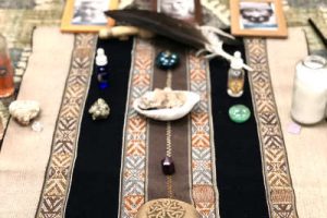 arrangement of ceremonial objects on wood floor